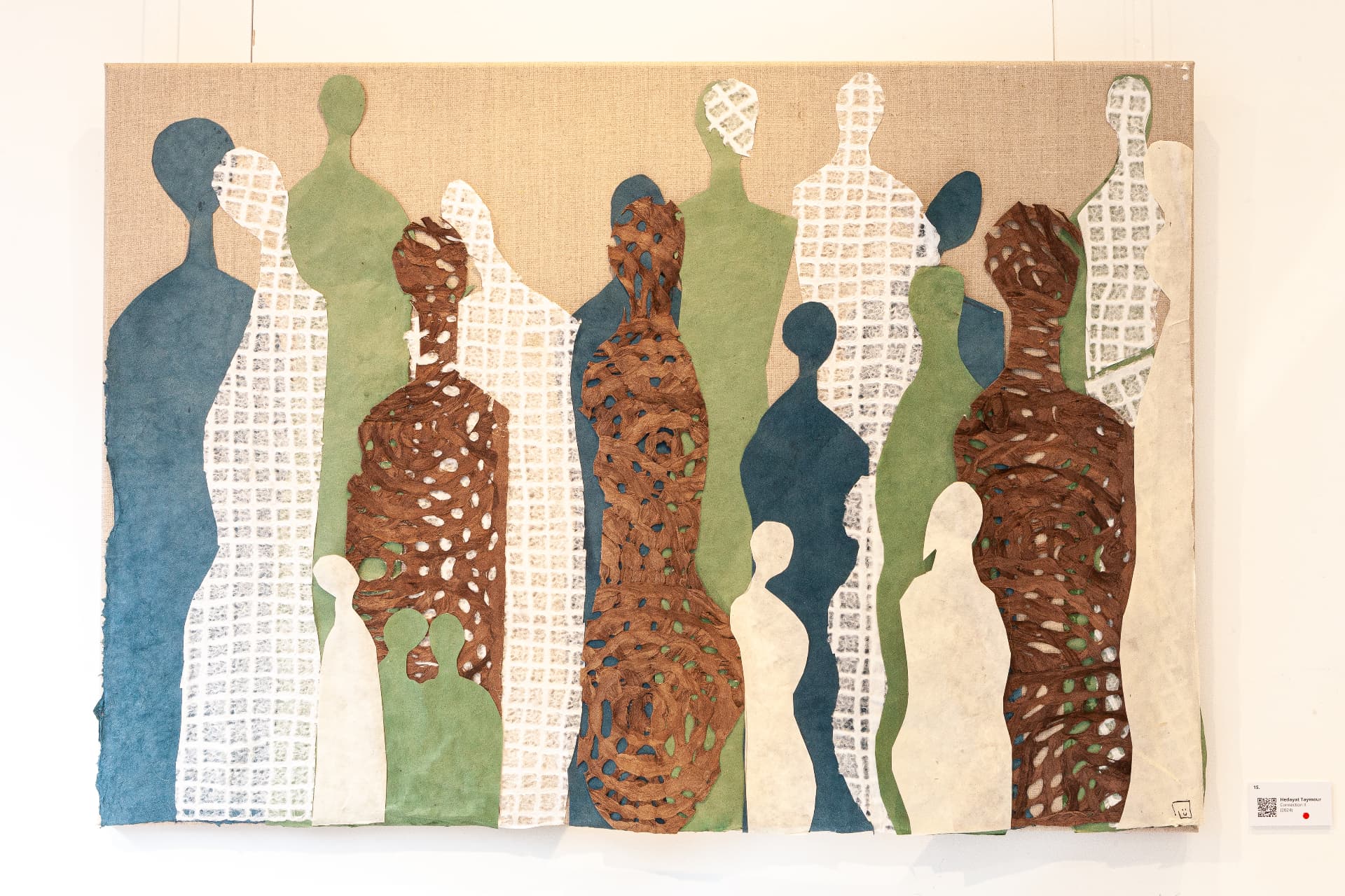 Collage on canvas with teal, green and terracotta figures